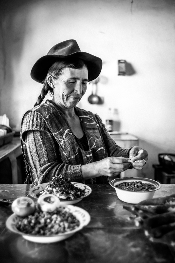 woman peels peanuts