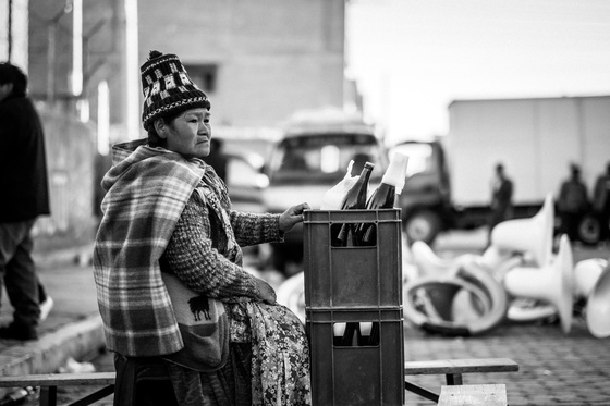 woman holds a beer crate