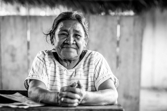 woman stares hands crossed