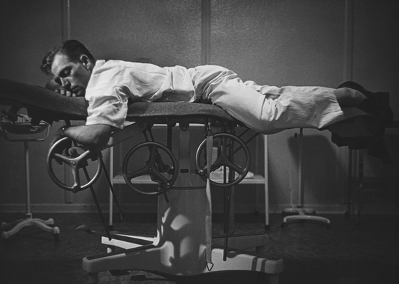 Country Doctor -  Dr. Ernest Ceriani Resting on Examination Table